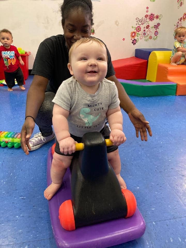 Child enjoying playtime at Mini Adventures Preschool in Warrensburg, MO.