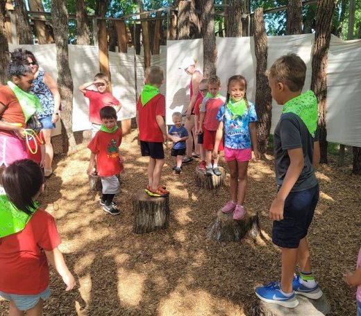Children enjoying outdoor play at Mini Adventures Preschool in Warrensburg, MO, promoting play-based learning.