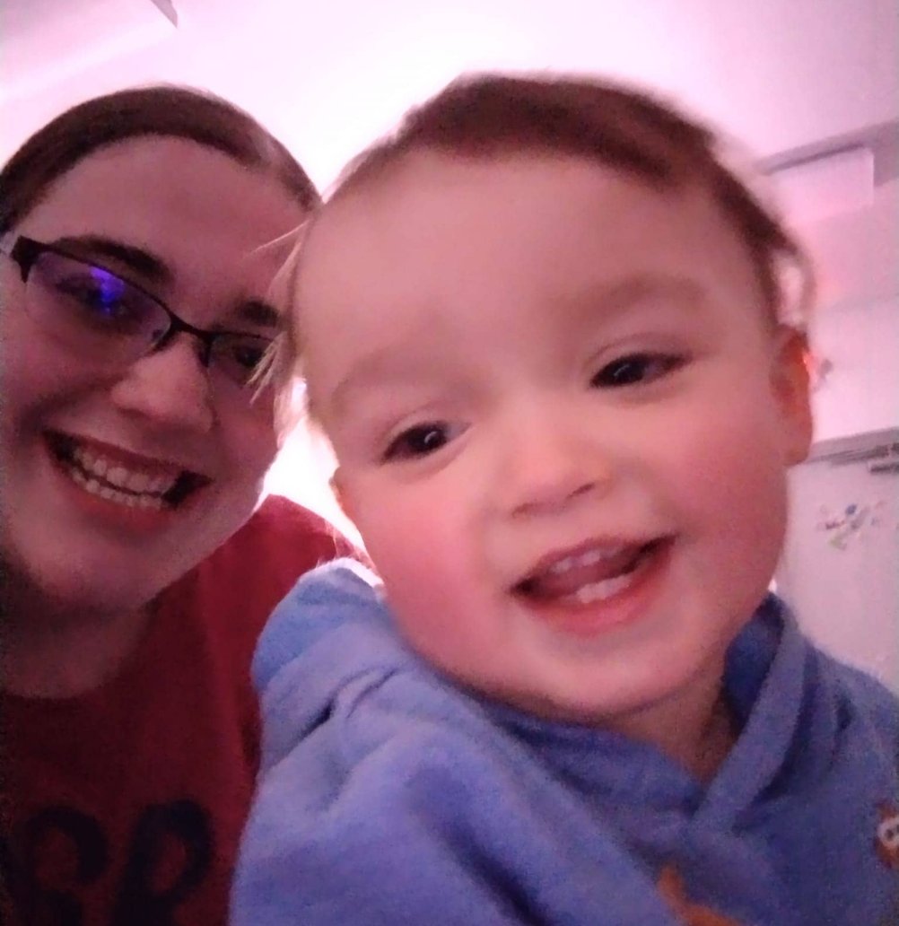 Happy child and teacher at Mini Adventures Preschool & Daycare, Warrensburg, MO.