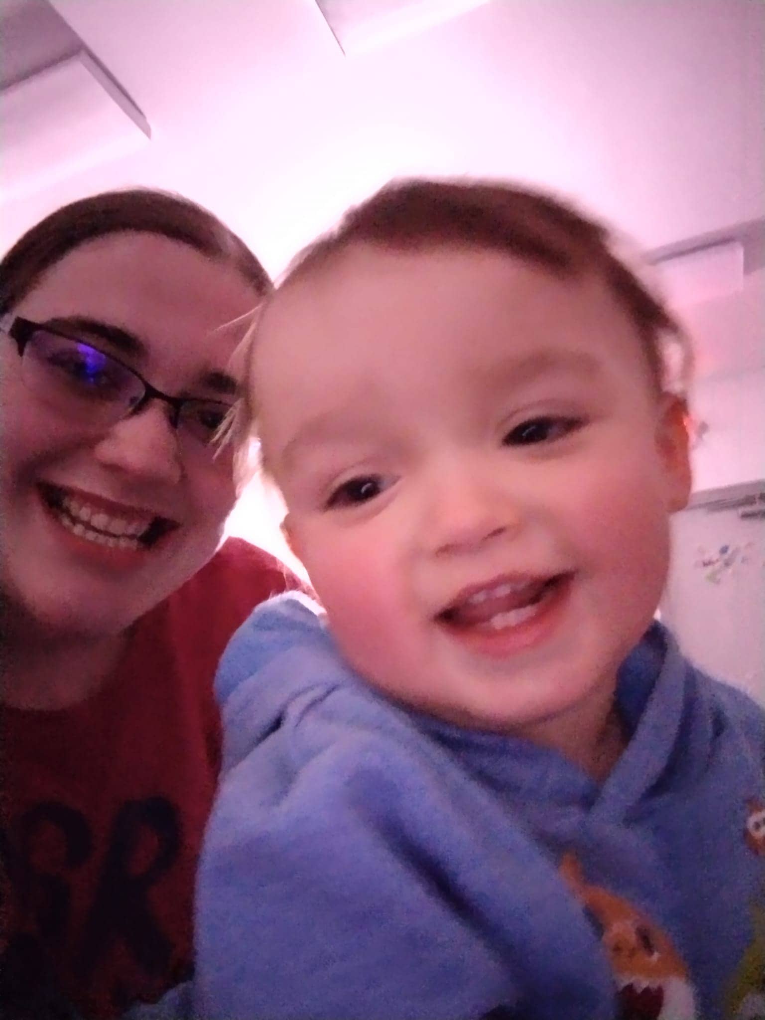 Happy child and teacher at Mini Adventures Preschool & Daycare, Warrensburg, MO.