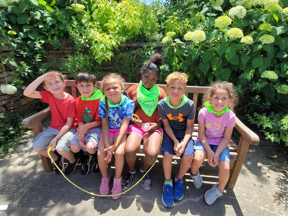 Children at Mini Adventures Preschool enjoying playtime on a sunny day in Warrensburg, MO.