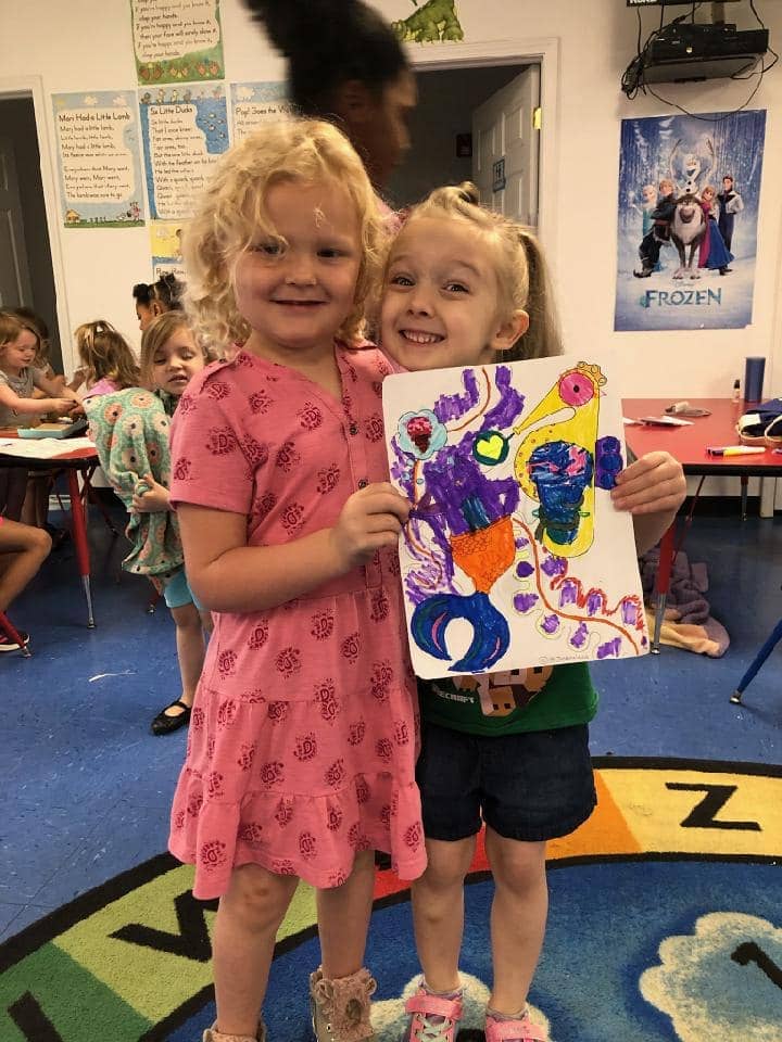 Children at Mini Adventures Preschool showing art in Warrensburg MO.
