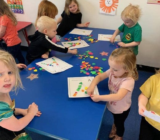 Children engaging in a craft activity at Mini Adventures Preschool in Warrensburg.