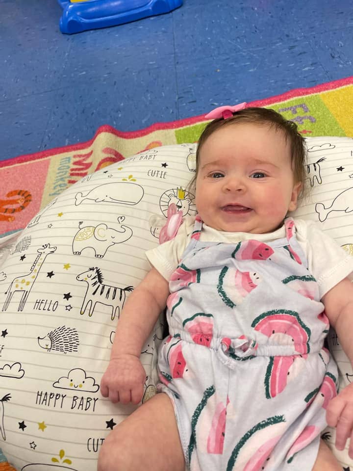Happy baby at Montessori-inspired daycare in Warrensburg, MO, in a nurturing and secure environment.