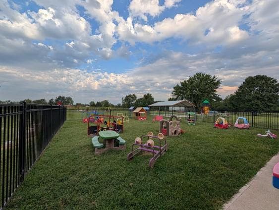 Active outdoor fun at Mini Adventures Preschool playground in Warrensburg, MO.