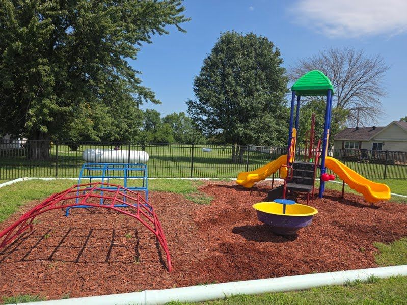 Children enjoying fresh-air play at Mini Adventures Preschool in Warrensburg, MO.