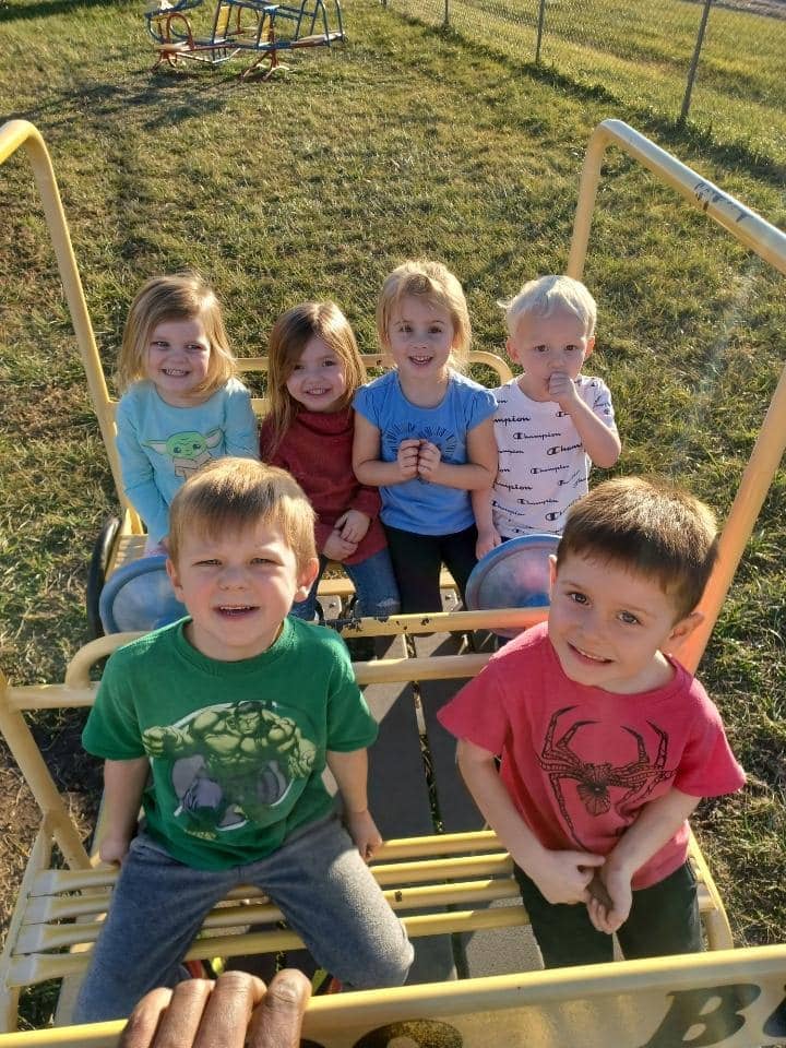 Children enjoying outdoor playtime at Warrensburg before and after school care program.